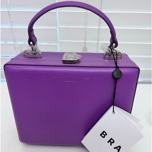 Brandon Blackwood purple leather trunk with silver hardware.